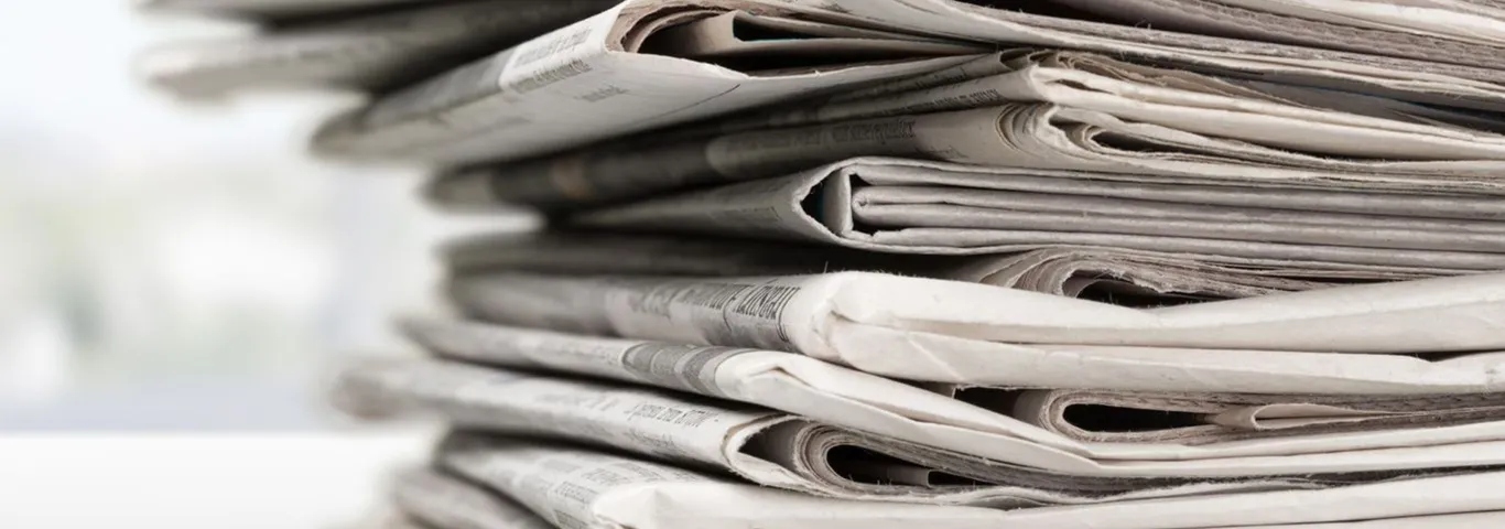 stacked newspapers