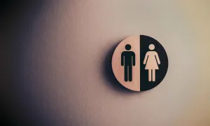a wall sign depicting male and female figures