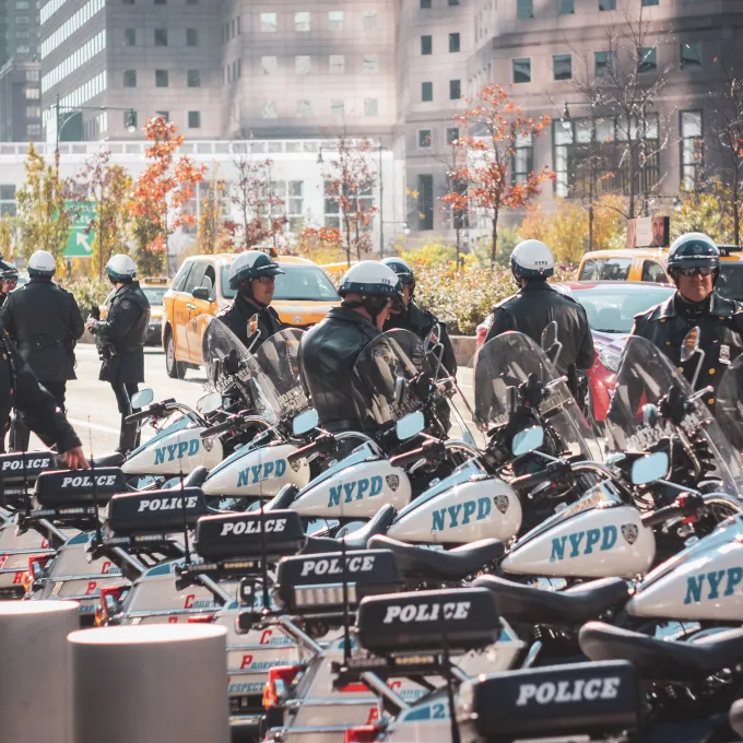 Police gathered near row of police motorcycles